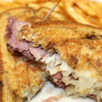 Reuben · Thinly sliced house-made corned beef, sauerkraut, Swiss cheese and 1000 Island dressing on g...