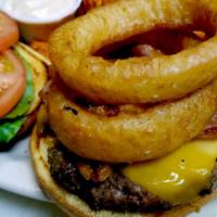 Bbq Bacon Burger · Beef patty topped with BBQ sauce, bacon, fried onion rings and cheddar cheese.
