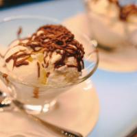 Vegan Almond Joy Ice Cream · A pint of chocolate, coconut cream, coconut milk, and almond milk flavored icecream.