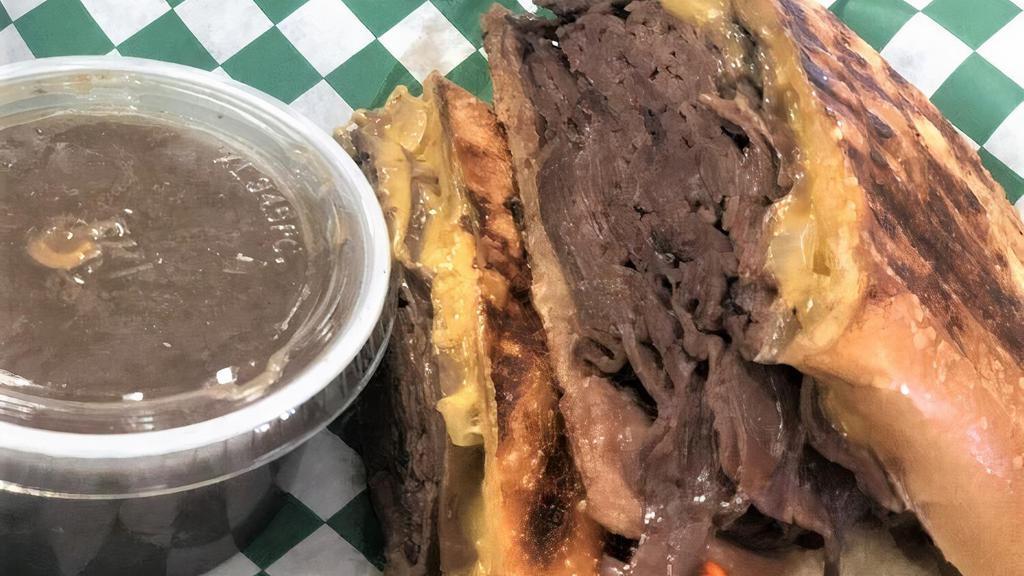 London Broil · Extra lean roast beef, caramelized onions, wisconsin cheddar, aju. Choice of side: kettle chips, potato salad, pasta salad or coleslaw.