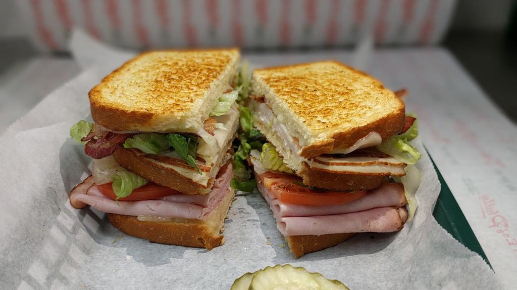 Club Sandwich · Ham, turkey, siwss, bacon, lettuce, tomato, mayo, triple stacked on sourdough.