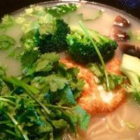 Tomato Fried Egg Noodle Soup · Includes spinach, cilantro, green onion, and pickle.