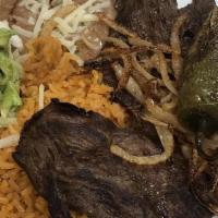 Carne Asada · steak char=broiled and garnished with grill onion and jalapeno. served with rice and beans, ...