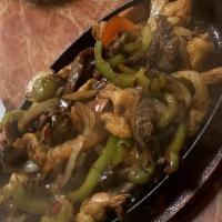 Fajitas Mixtas · steak, shrimps, and chicken, sauteed with bell peppers, onions. served with beans and rice, ...