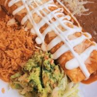 Burrito Plate · flour tortilla filled with choice of meat, topped with salsa sour cream, cheese. served with...
