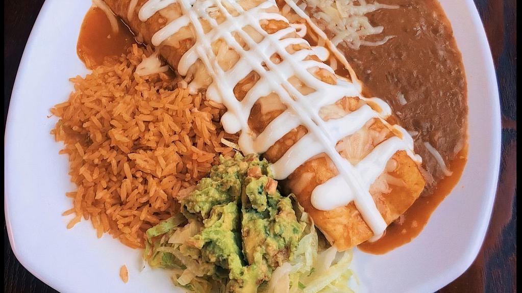 Burrito Plate · flour tortilla filled with choice of meat, topped with salsa sour cream, cheese. served with beans and rice, guacamole on the side.