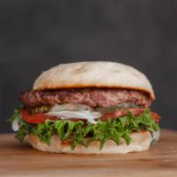 Chom Burger · All-American 1/3 lb. beef patty, toasted bun. CHOM sauce, lettuce, tomato, pickles, onion.