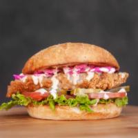 Fried Chicken Sandwich · Deep fried chicken breast, toasted bun, CHOM sauce, lettuce, tomato, pickles, pepper jack ch...