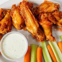 Hot Buffalo Wings · Our mouth watering, award winning hot wings served with carrots and celery, and choice of di...