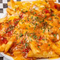 Chili Fries · Spicy pork green or house red chili with cheese. Diced onions on request.