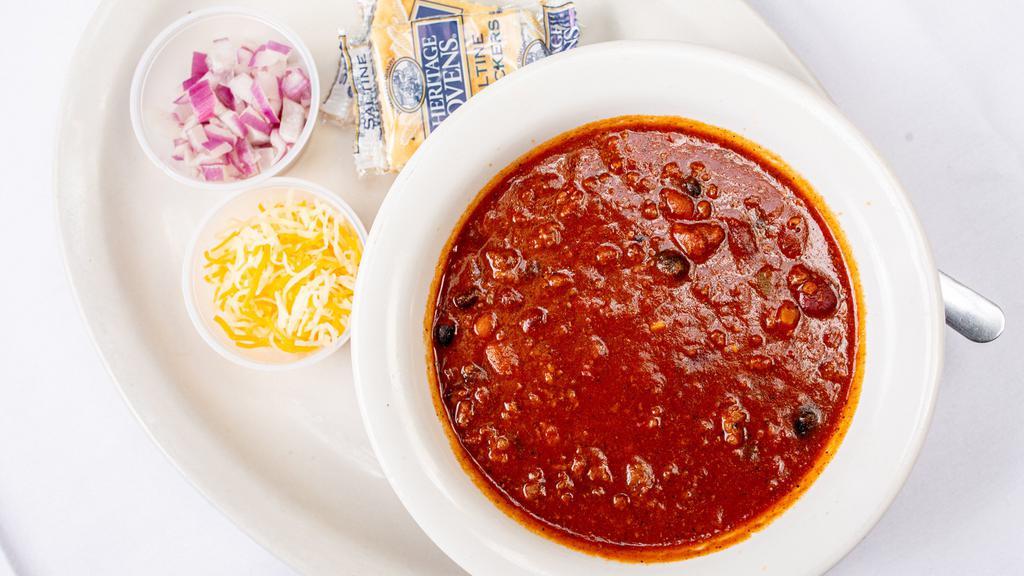 Cup Of Chili · Cup of red chili served with crackers or pork green chili served with tortilla.