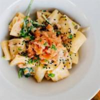 Smoked Salmon · Smoked salmon, creme fraiche, spinach, topped with pine nuts and capers. This sauce contains...