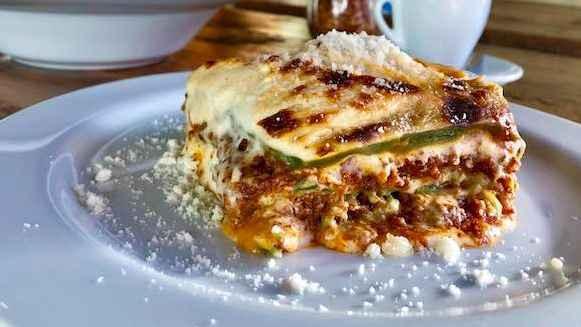 Lasagna Alla Bolognese · Traditional bolognese sauce and homemade bechamel layered in egg dough pasta, baked in the oven.