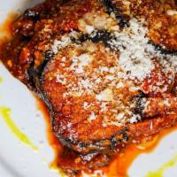 Eggplant Parmigiana · Fried eggplants with house-made tomato sauce, caciocavallo, and Parmigiano cheese.