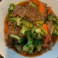 Broccoli Beef · Slices of choice flank steak stir-fried with broccoli and carrots in a tasty brown sauce.