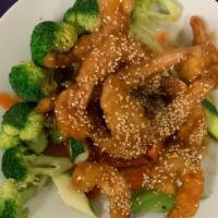 Sesame Shrimp · Hot and spicy. Crisp fried shrimp covered with sweet spicy sauce on a bed of steamed vegetab...