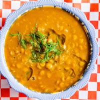 Lentil Soup · Delicious lentil soup made with lentils, potatoes, onions, spices, and garnished with fresh ...