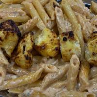 Penne Gorgonzola Chicken Pasta · Creamy Gorgonzola sauce with penne pasta and grilled chicken, served with garlic bread. Come...