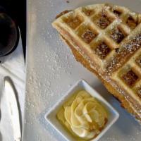 Chicken & Waffle · Classic waffle topped with fried chicken, powder sugar, and a side of butter.