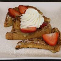 Classic French Toast · Topped with butter and powder sugar.