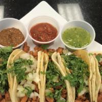 Bros Street Tacos · Three tacos served with beans and rice, served with onions, cilantro, and salsa on the side....