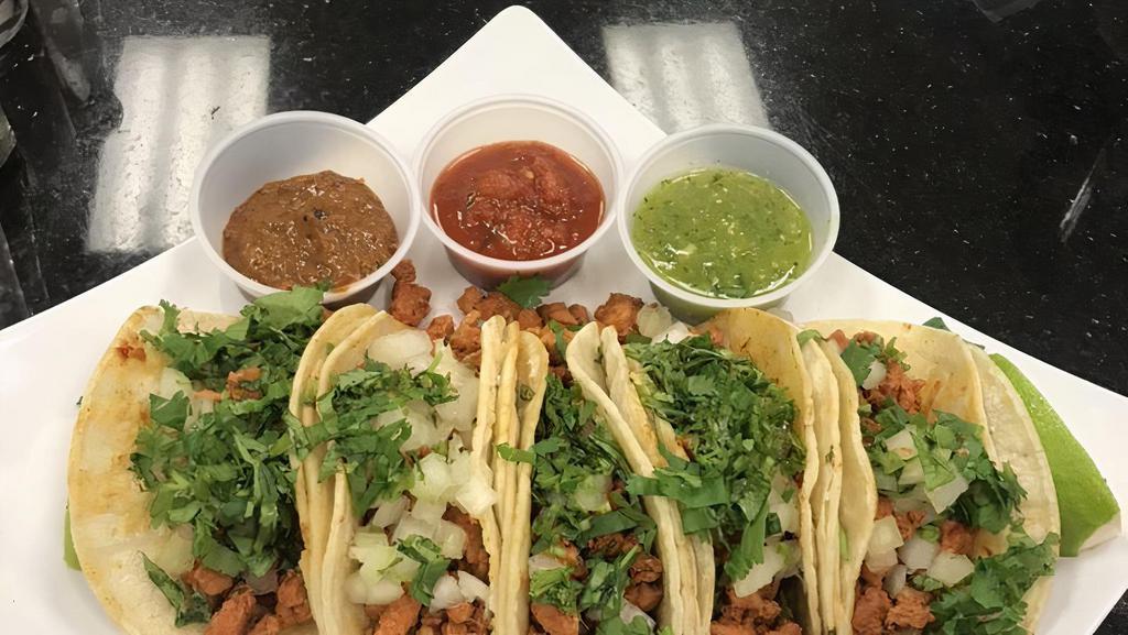 Bros Street Tacos · Three tacos served with beans and rice, served with onions, cilantro, and salsa on the side. Your choice of either asada (steak), pollo (chicken), adobada (our famous marinated pork).