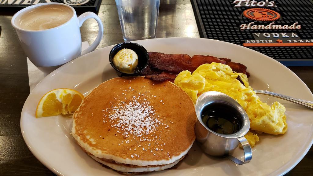 The Pancakes Combo · Two large pancakes served with two eggs any style, biscuits, and choice of bacon, sausage, or ham.