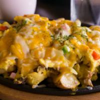 Ranch Skillet · Ham, sausage, bacon, diced onions, skillet brown potatoes, bell peppers, scrambled eggs, gra...