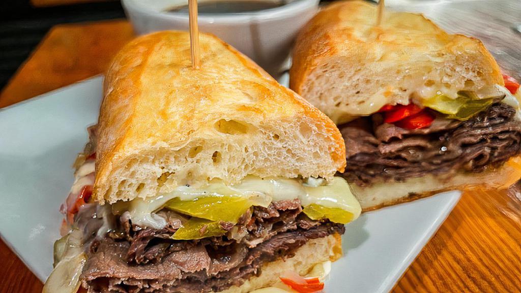 Cascadia Dip · House roast beef, swiss, grilled onion and peppers, horseradish mayo with a side of au jus.