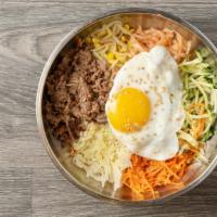 Bibimbop · Rice topped with beef, vegetables, and egg.