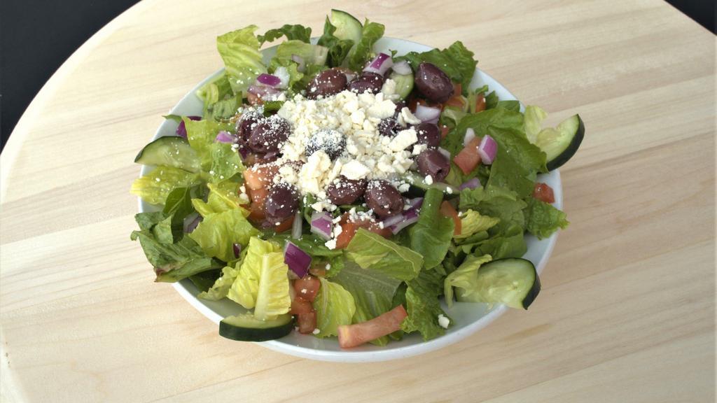 Chopped Greek Salad · Tomato, green peppers, red onion, feta, kalamata olives, and cucumber on mixed greens with our home-made Greek dressing.