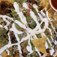 Nachos · Your choice of meat covered with cheese, guacamole, sour cream, pico de gallo, and pickled j...