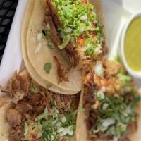 Street Tacos · Filled with a choice of meat, garnished with cilantro and onions. Served with salsas. Add le...