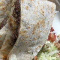 Meat Quesadilla · Flour tortilla filled with your choice of meat and cheese, toasted, and topped with Pico de ...