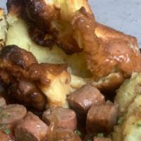 English Bangers N’ Mash · Sausage in a brown onion gravy with home-made mashed potato and a yorkshire pudding.