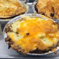 Cumberland Pie · Seasoned ground beef topped with home-made mashed potatoes and cheese, served with peas