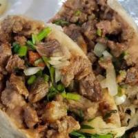 Burrito Clásico / Classic Burrito · Incluye cebolla, cilantro y frijoles. / Includes onion, coriander and beans.