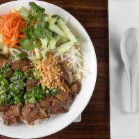 Grilled Pork (Bún Heo Nướng) · Vermicelli noodles served in a bowl with shredded iceberg lettuce, pickled shredded carrots,...
