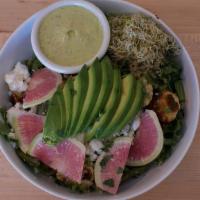 Green Goddess Quinoa Bowl · Fresh greens topped with herbed quinoa lightly sautéed with roasted cauliflower, sweet potat...