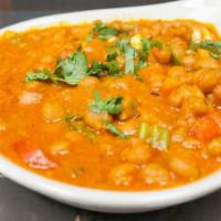 Chana Masala · Chick peas and potatoes cooked with mild herbs and spices.