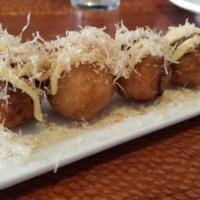4 Takoyaki · Japanese fritter made of savory batter and filled with diced octopus and spices, topped with...