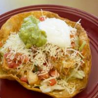 Taco Salad · Fresh bed of lettuce topped with shredded jack cheese, our savory cooked chicken, or ground ...