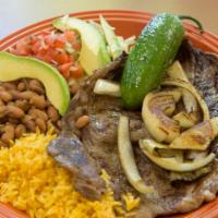 Carne Asada Plate · A generous portion of thin sliced beef steak, grilled to perfection, and served with grilled...