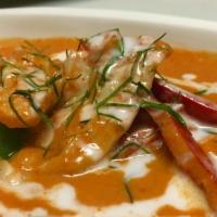 Panang · Panang curry paste with rich coconut milk, bell pepper and sliced lime leaves.