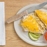 Breakfast Burrito · Scrambled eggs, bacon, onions, potatoes, and Cheddar cheese rolled into a warmed flour torti...