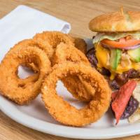 Southwest Burger · This burger is topped with bbq sauce, melted Cheddar cheese, smokey bacon, avocado, and fren...
