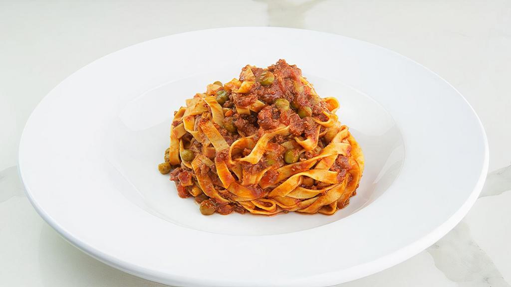Tagliatelle Bolognese · bolognese meat sauce, parmigiano. Handcrafted in-house daily with imported italian semolina flour. Contains eggs (locally farmed).