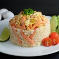 -Crab Fried Rice · Thai jasmine rice stir-fried with egg and white onion in light sauce topped with . crab and ...