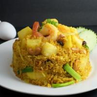 -Pineapple Fried Rice · Stir-fried jasmine rice with yellow curry powder, pineapple, carrot, white onion, raisin, . ...