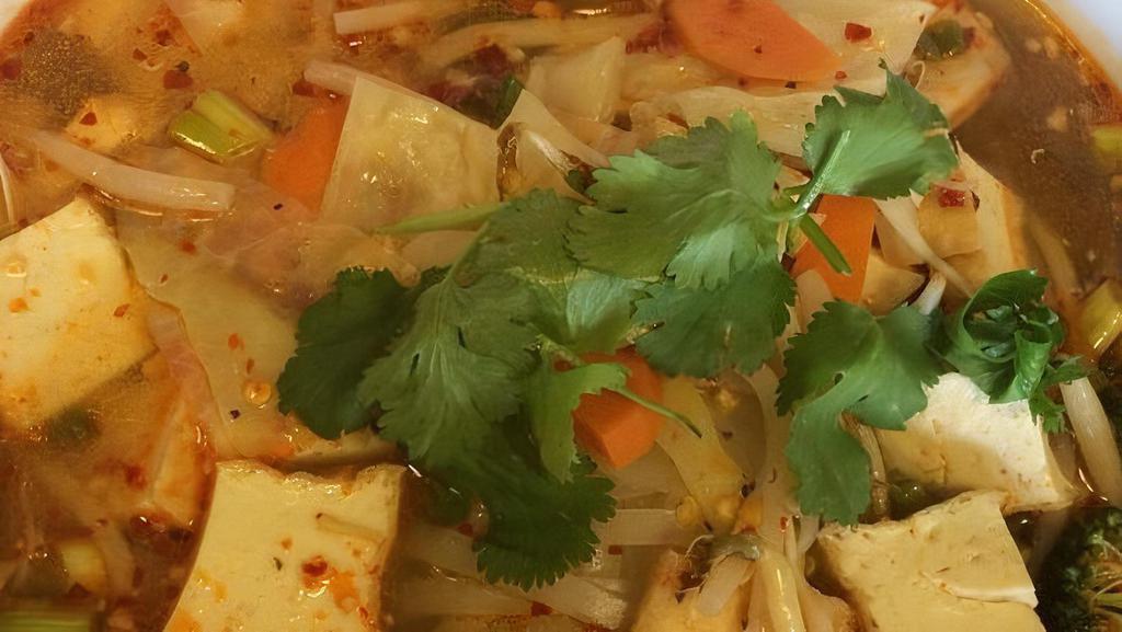 Tom Yum Noodle Soup · Lime juice, pork, peanuts, red pepper, green onions, rice noodles and cilantro.